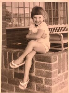 Young me sitting on a ledge